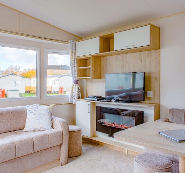 Interior shot of the lounge area in a Park Compact caravan holiday home at Pinewoods.