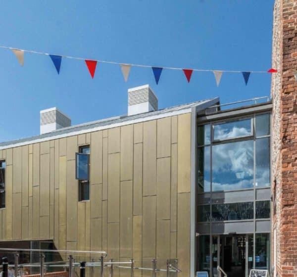 Bunting and blue sky around Wells Maltings cultural centre in Norfolk.